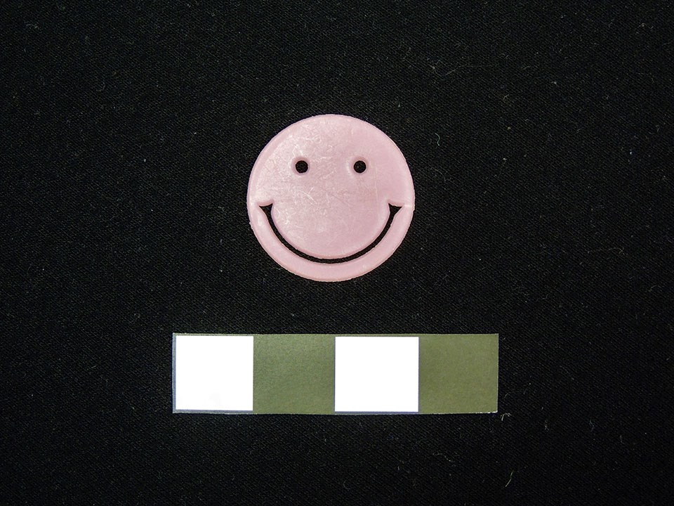 pink circle with a smiley face on it