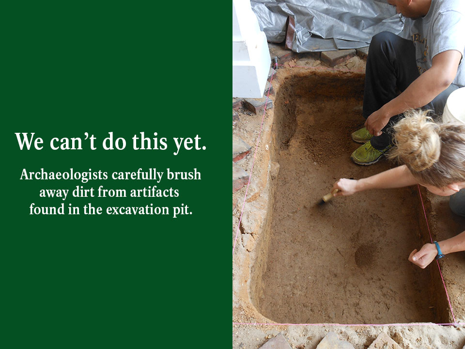 An archaeologist looks through the scope of a survey instrument to take measurements before excavation work begins.