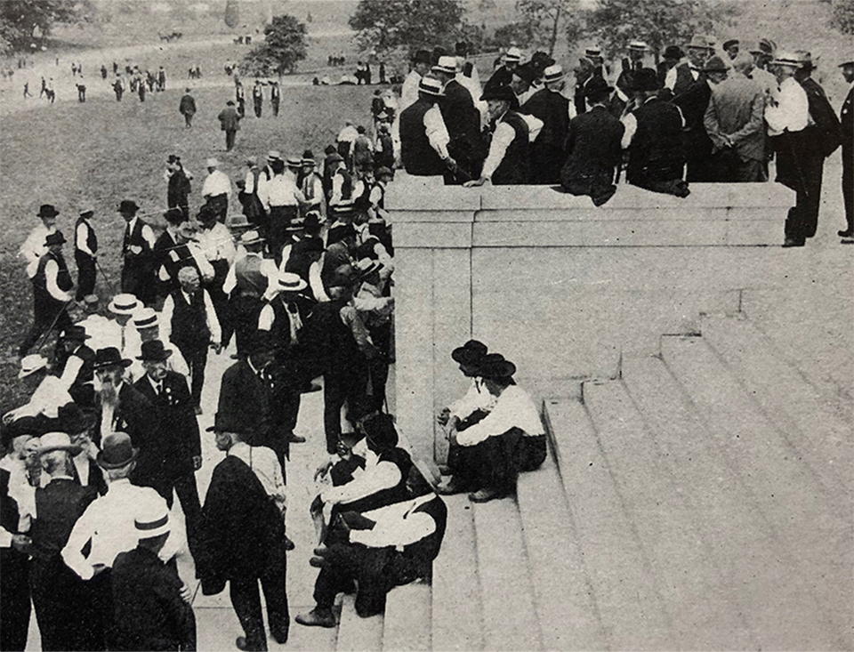 A black and white picture of Civil War veterans sitting on the lower steps of the Pennsylvania Memorial.