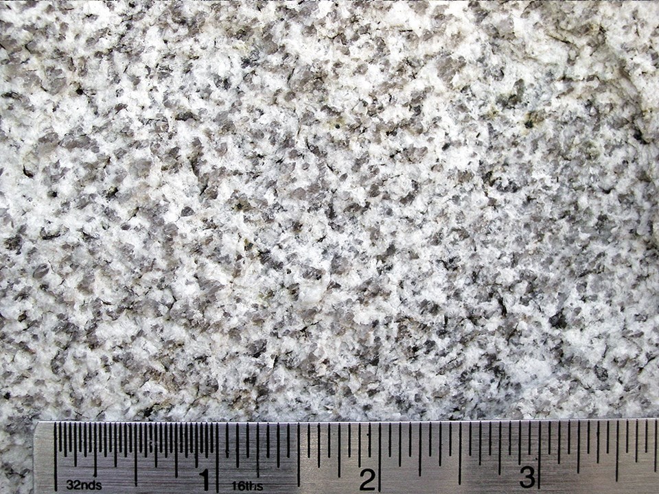 Green Creek Complex - Dark gray granite with large white crystals of potassium feldspar.