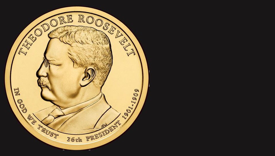 A gold dollar coin showing Teddy Roosevelt's image