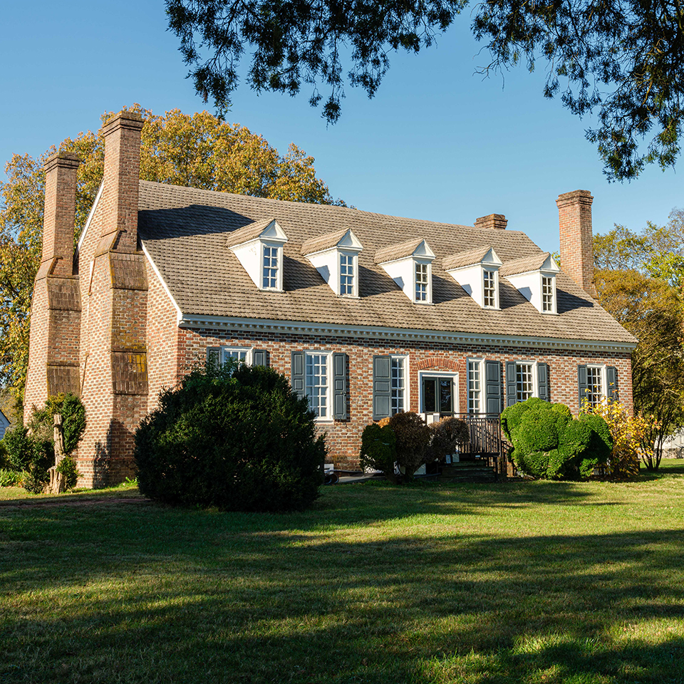 smoking square kiln with bricks stacked nearby