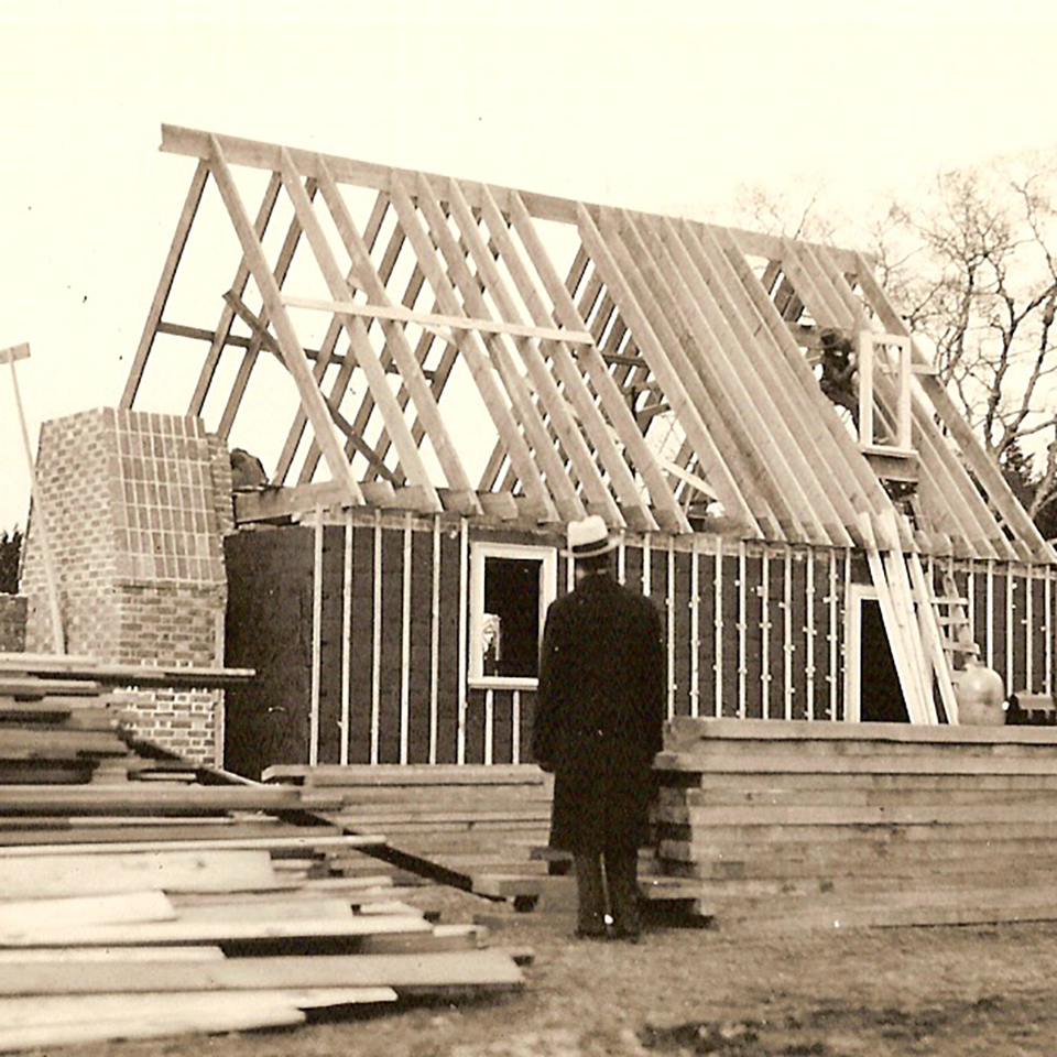 person standing looking at frame of colonial revival kitchen