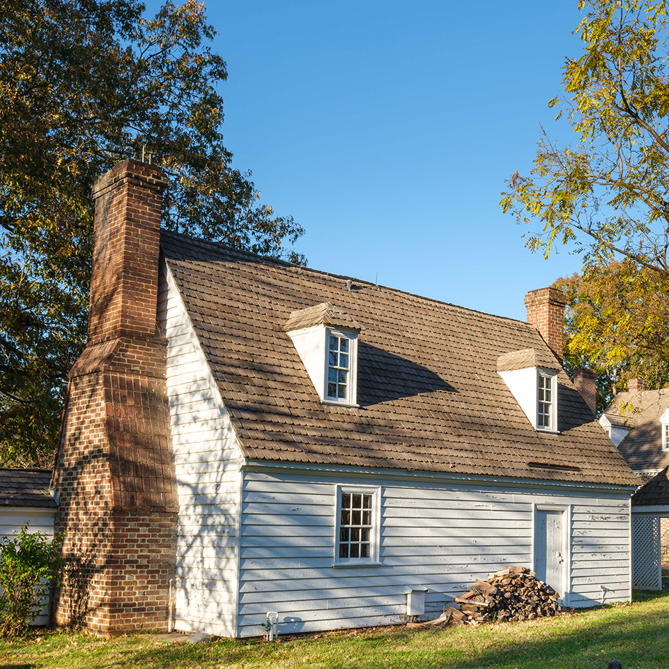 person standing looking at frame of colonial revival kitchen