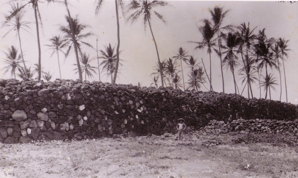 Historic photograph of the Great Wall with boy standing in front of it (late 1800s)