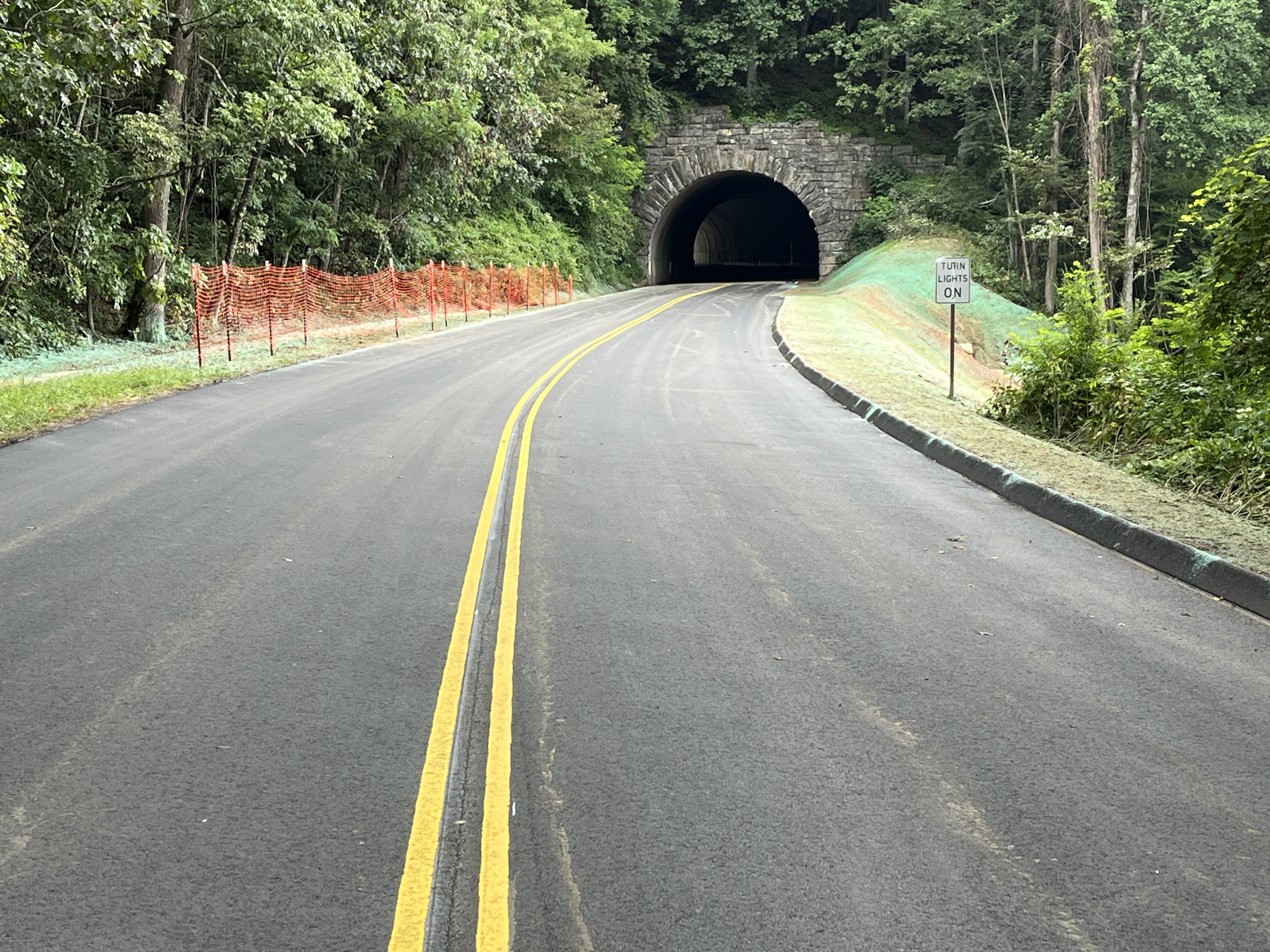 Crews work to rebuild the roadway and slope near Ferrin Knob Tunnel #3 after Hurricane Helene.