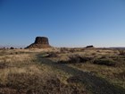 trail leading to a large rock with a flat top