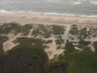 aerial view of sandy coast with evidence of dune breach washover