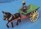Antique mule cart toy with an iron figurine of an African American driver
