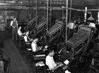 Men working at linotype machines