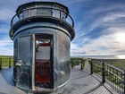 Photograph of door leading into the top level of a lighthouse from balcony