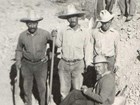 Historic photo of 4 people at a fossil quarry.