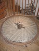 A bed grinding stone inside a historic and fully restored English mill. 