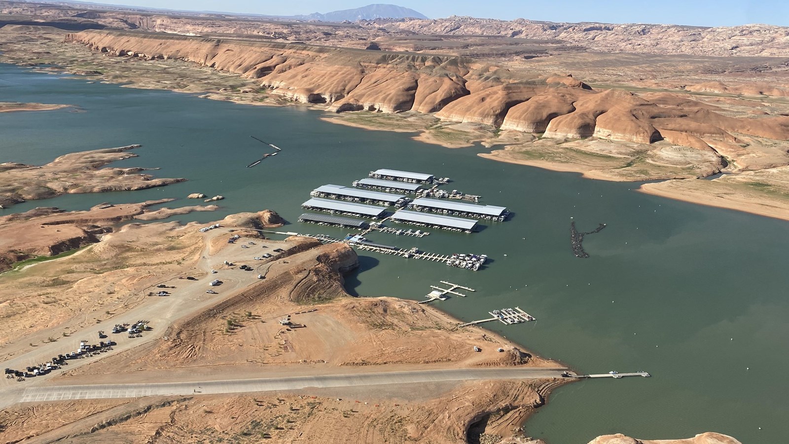 Long concrete launch ramp leads to a desert lake