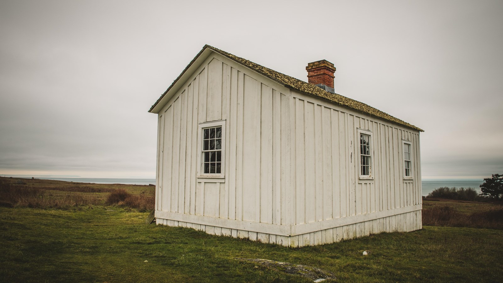 Photograph of a white building made of wood