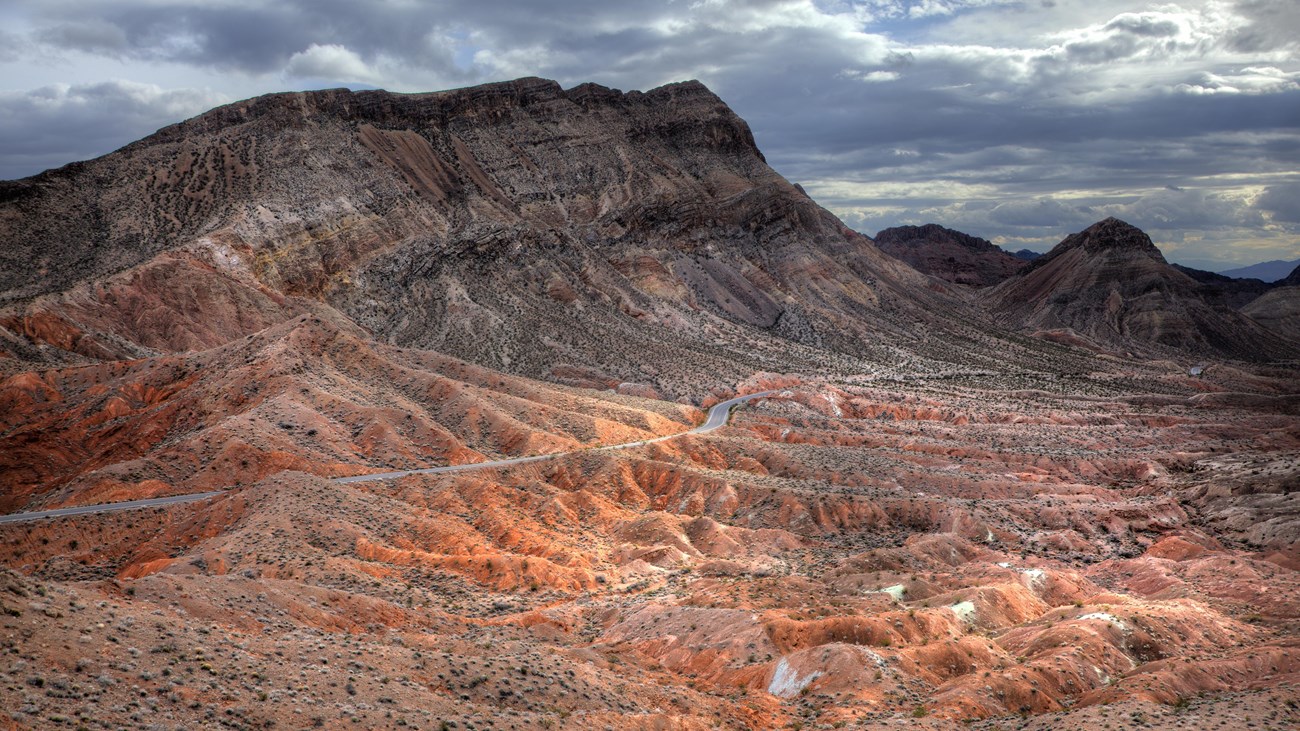 A road winds through a mountainous landscape