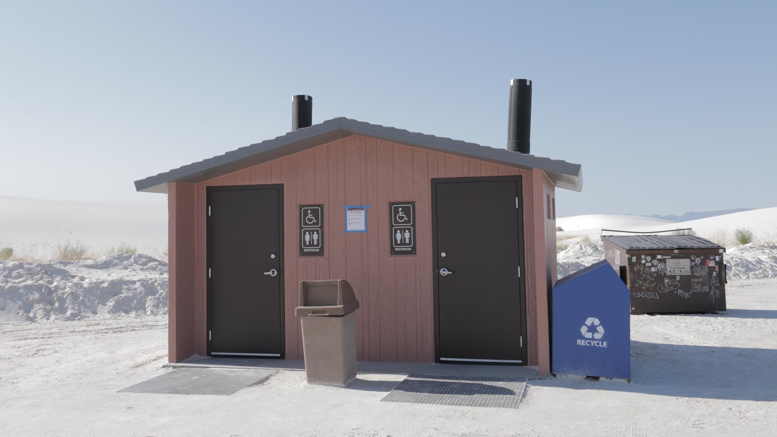 The Backcountry Camping Loop Trail restroom with its recycling and trash receptacles.