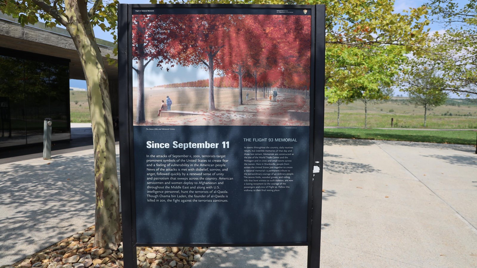 Image of a sign with image of landscape memorial.