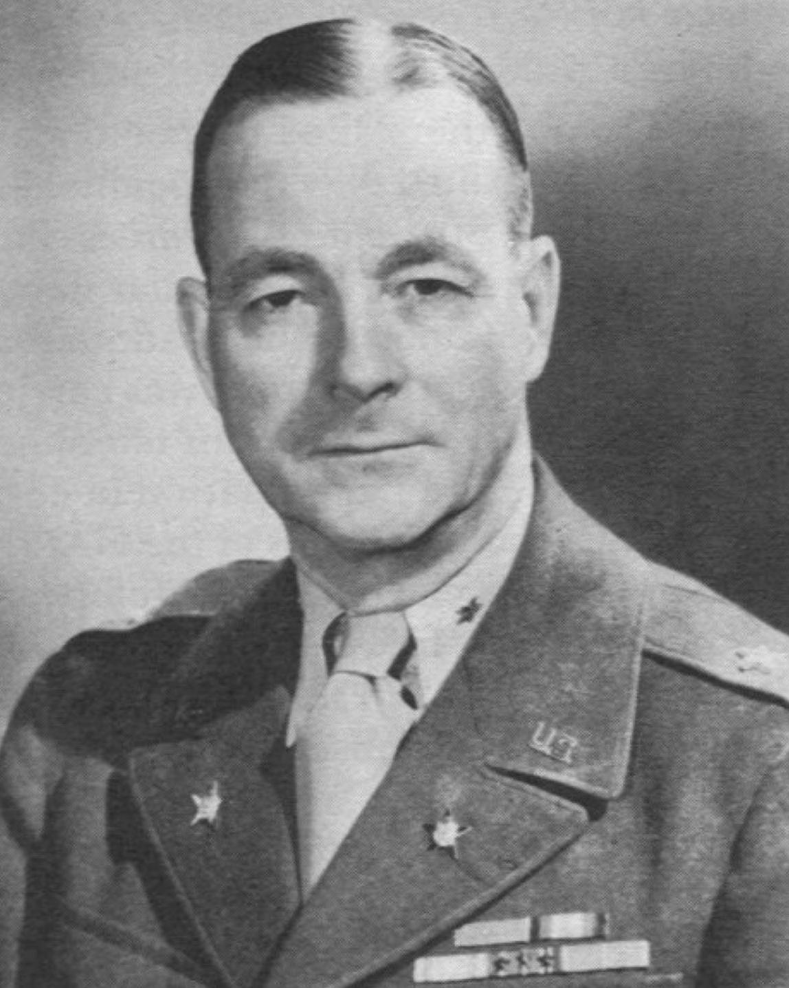 A black and white photograph of a man in military uniform