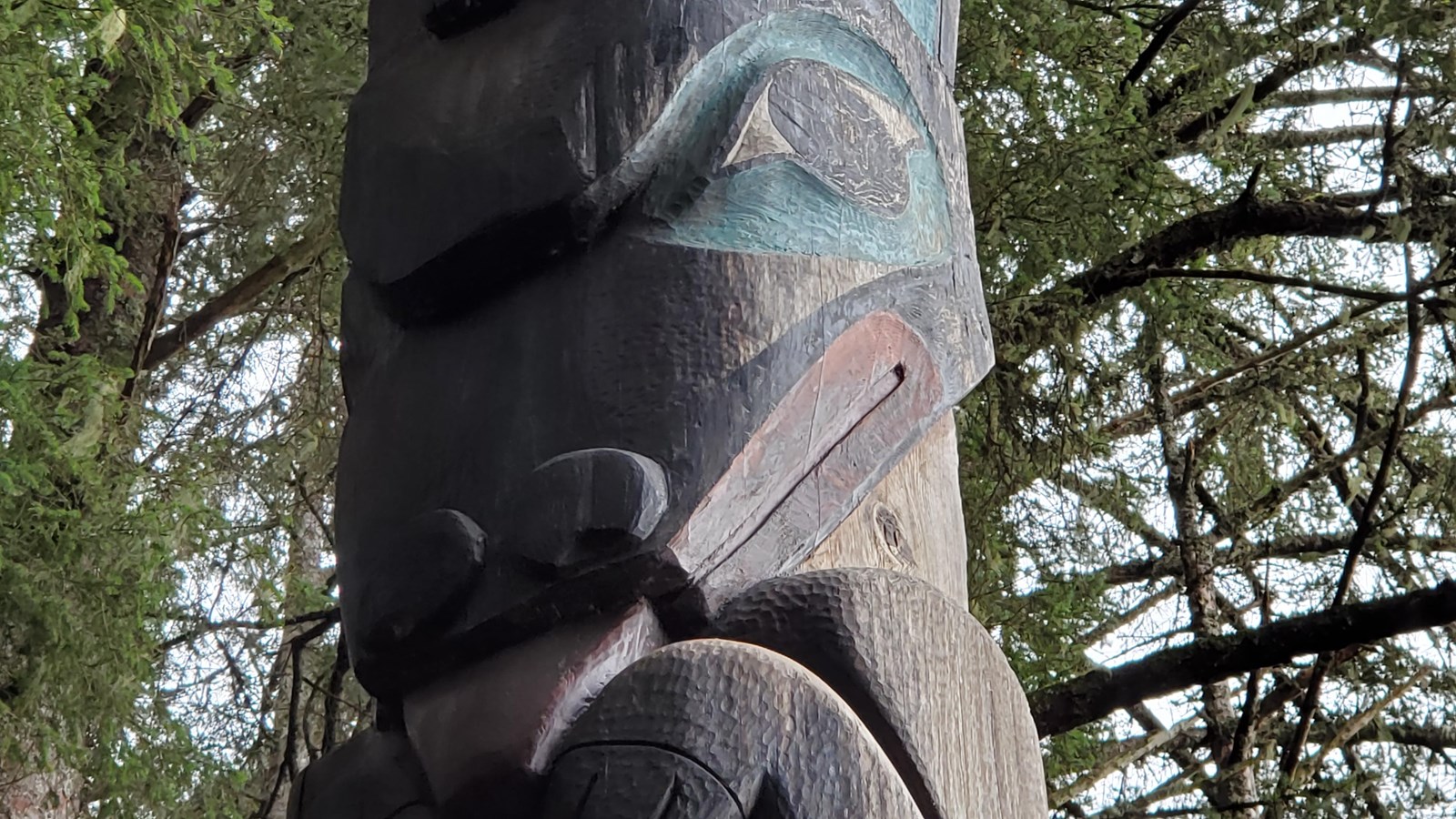 Close up of the face on the Wolf Pole