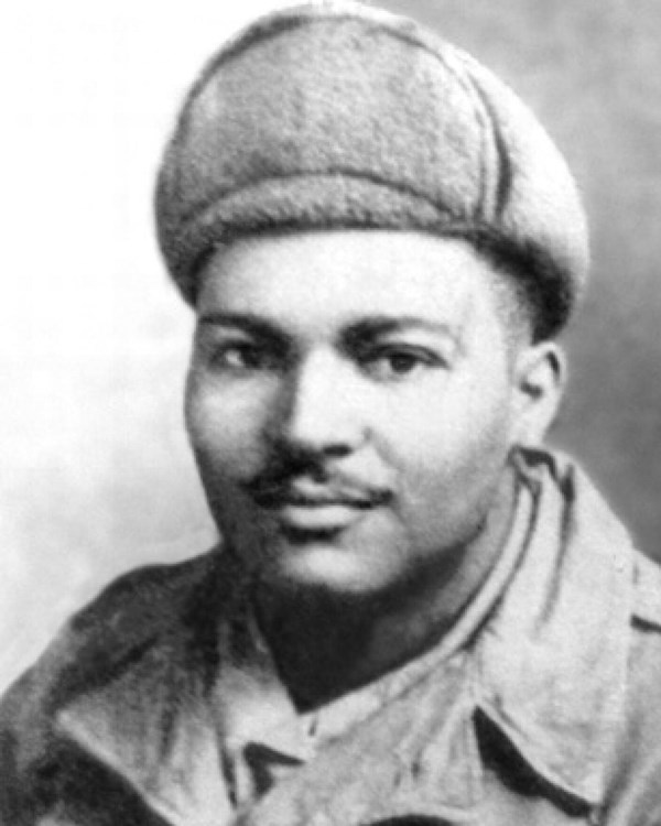 African American man in Army uniform during the Korean War. He is wearing a winter hat