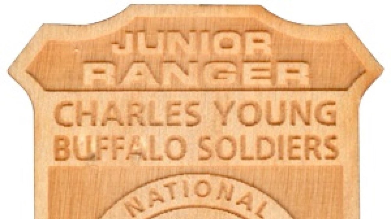 Wooden junior ranger badge that says Charles Young Buffalo Soldiers National Monument