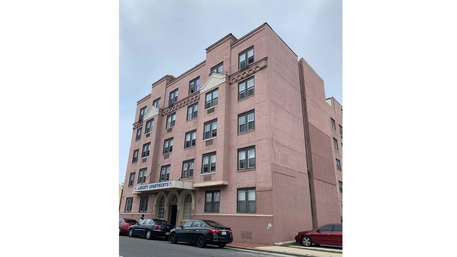 a five-story, U-shaped, brick building that is seven bays at the first story 