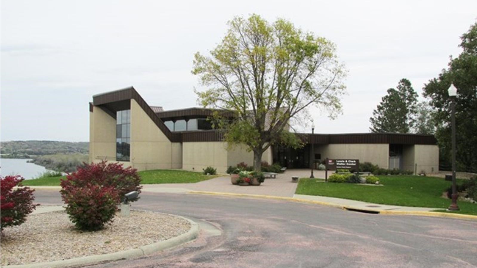 Lewis and Clark Visitor Center overlooking the Missouri River. Circular drive featuring plants.