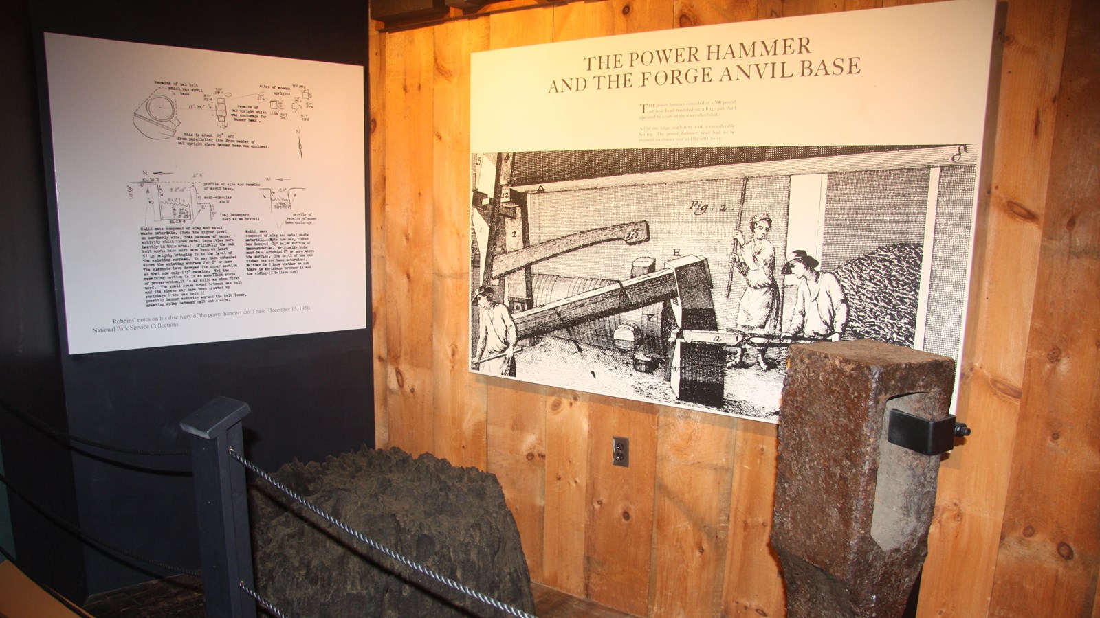exhibit with images showing how items were used and made as well as original anvil base and hammer