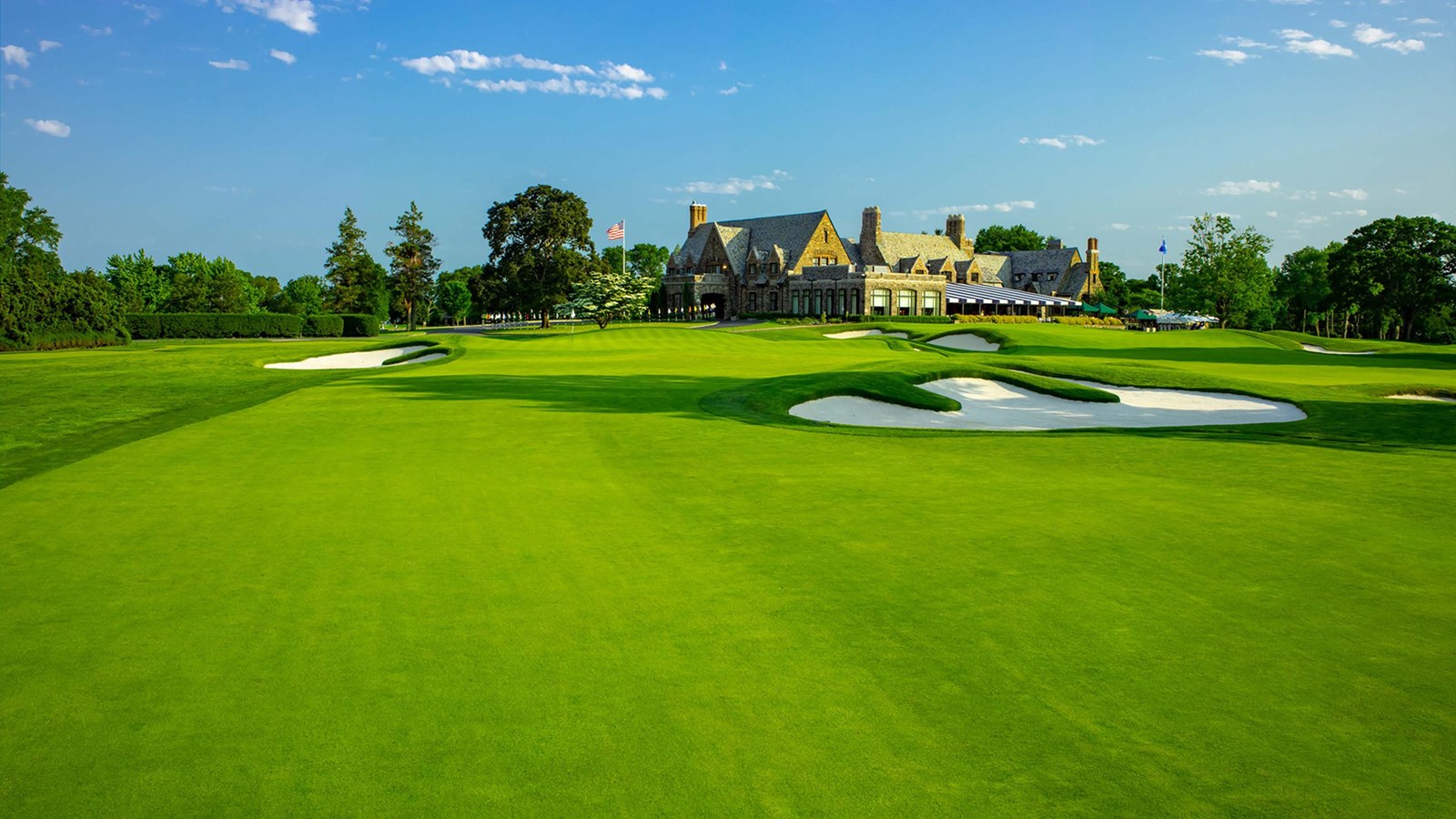 clubhouse as viewed from north, across an expanse of the golf course