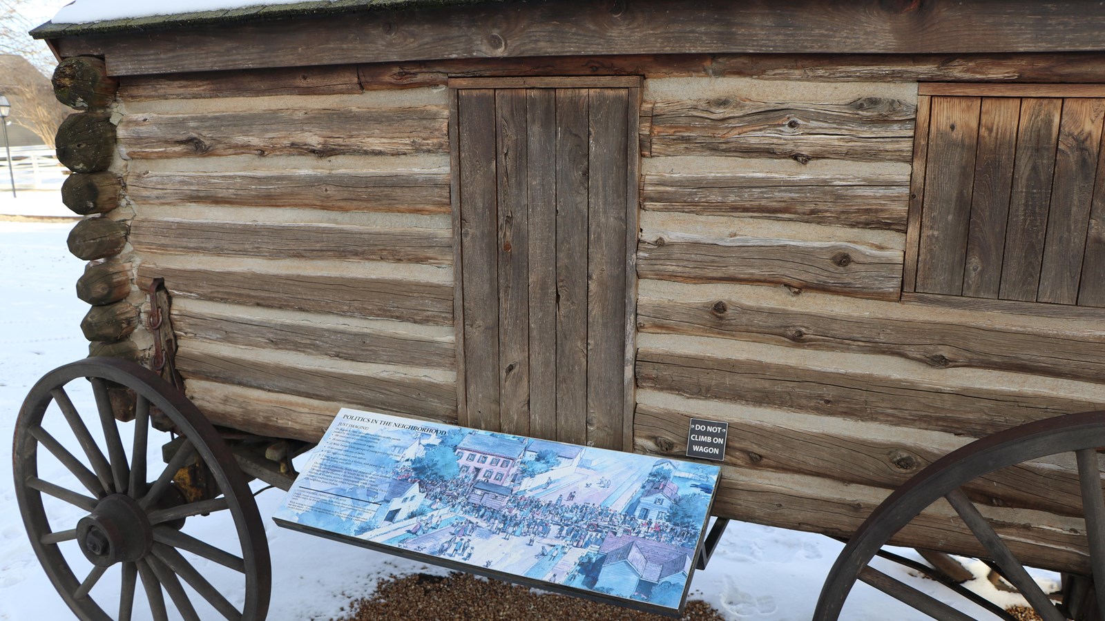 Outdoor Wayside Exhibit attached to replica wooden political campaign wagon
