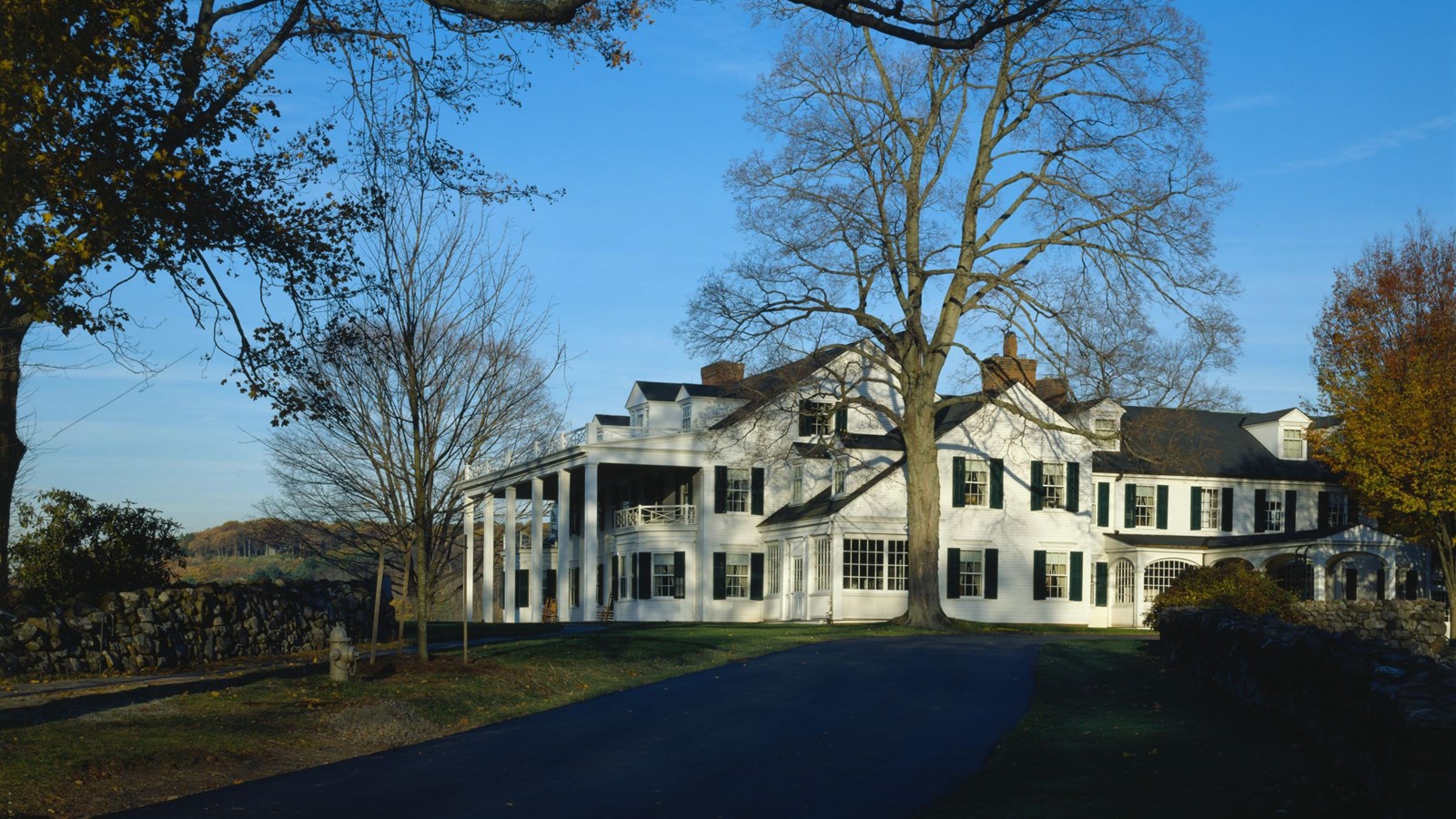 White Colonial Revival style home on a sprawling Connecticut estate.
