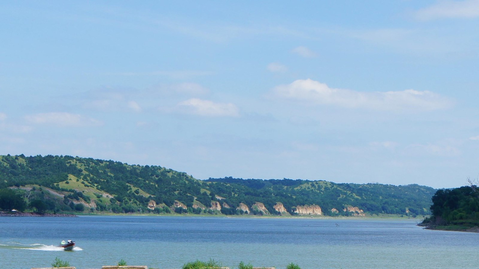 Boat on the river by Randall Creek Recreation Area