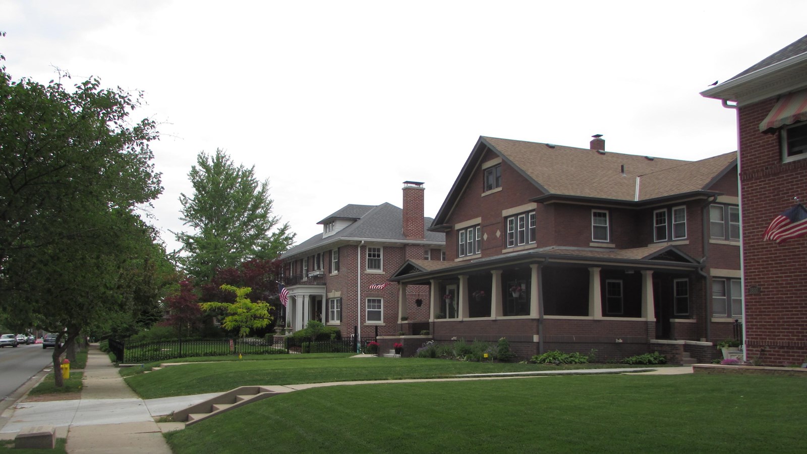 Rows of historic homes of various styles. Deep setbacks, tree line streets.