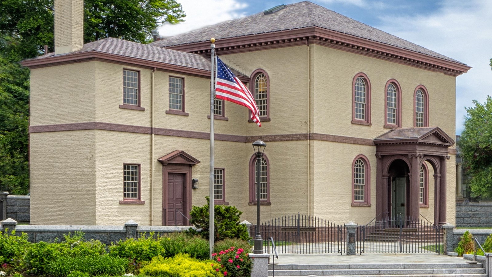 A rectangular, cream-colored, two-story building.