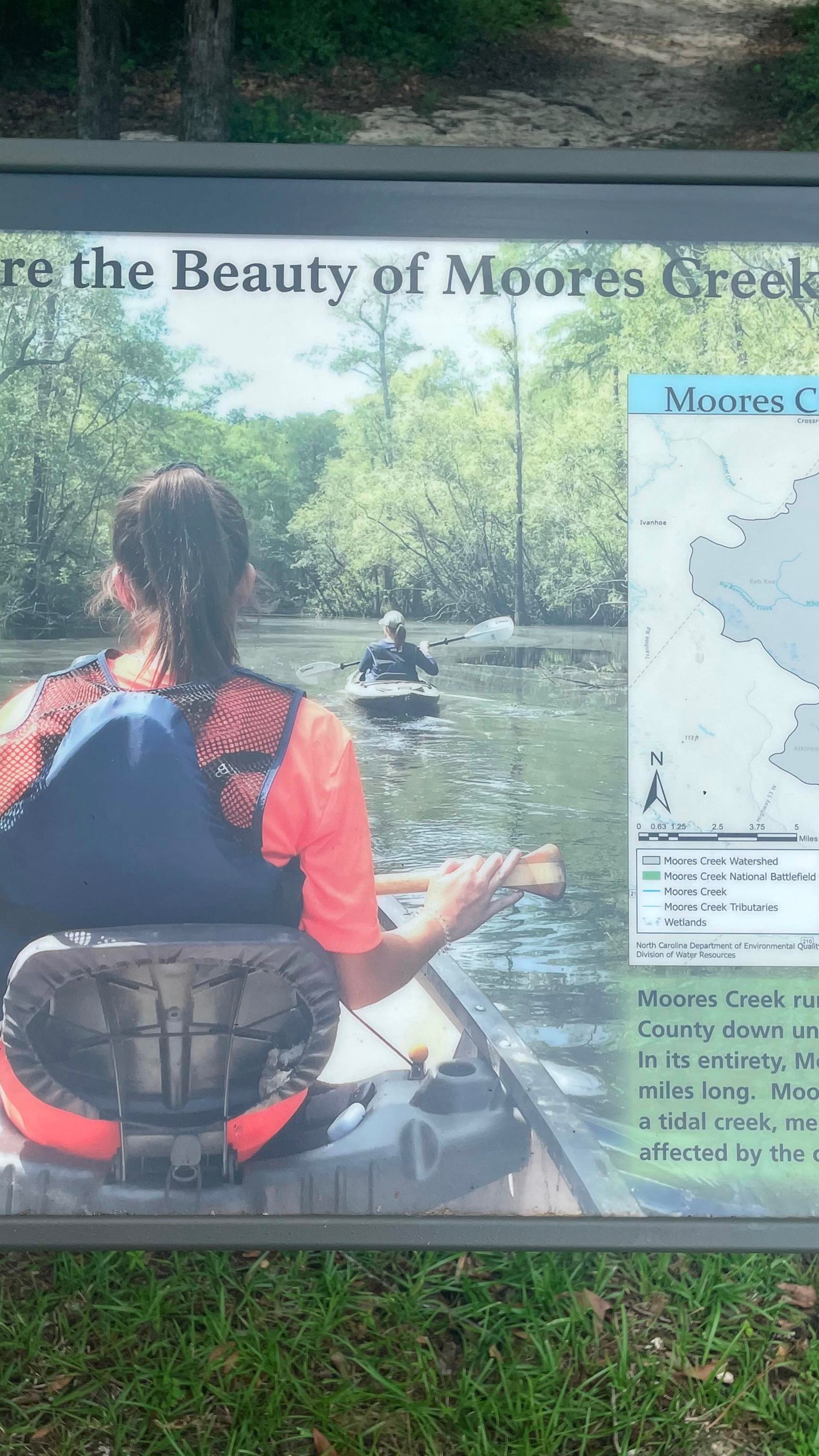 36 x 24 sign with kayakers and a map of the watershed.