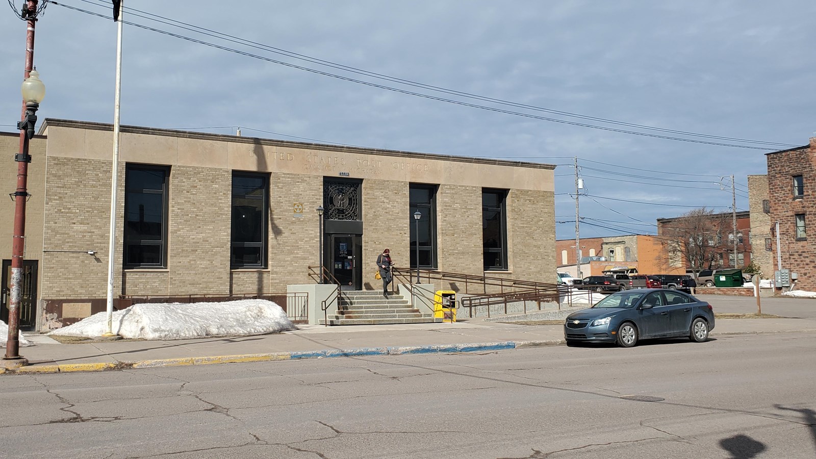 Brick one-story building with long vertical windows