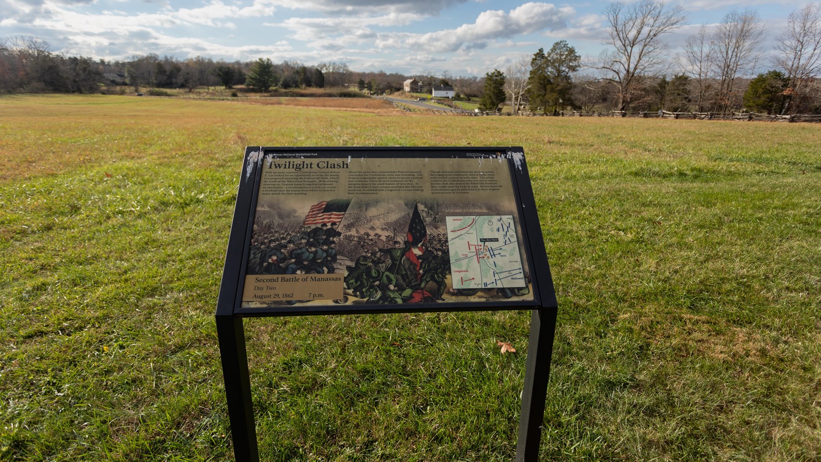 An drawing of two armies, green and blue, holding flags aiming weaponry at each other is depicted.