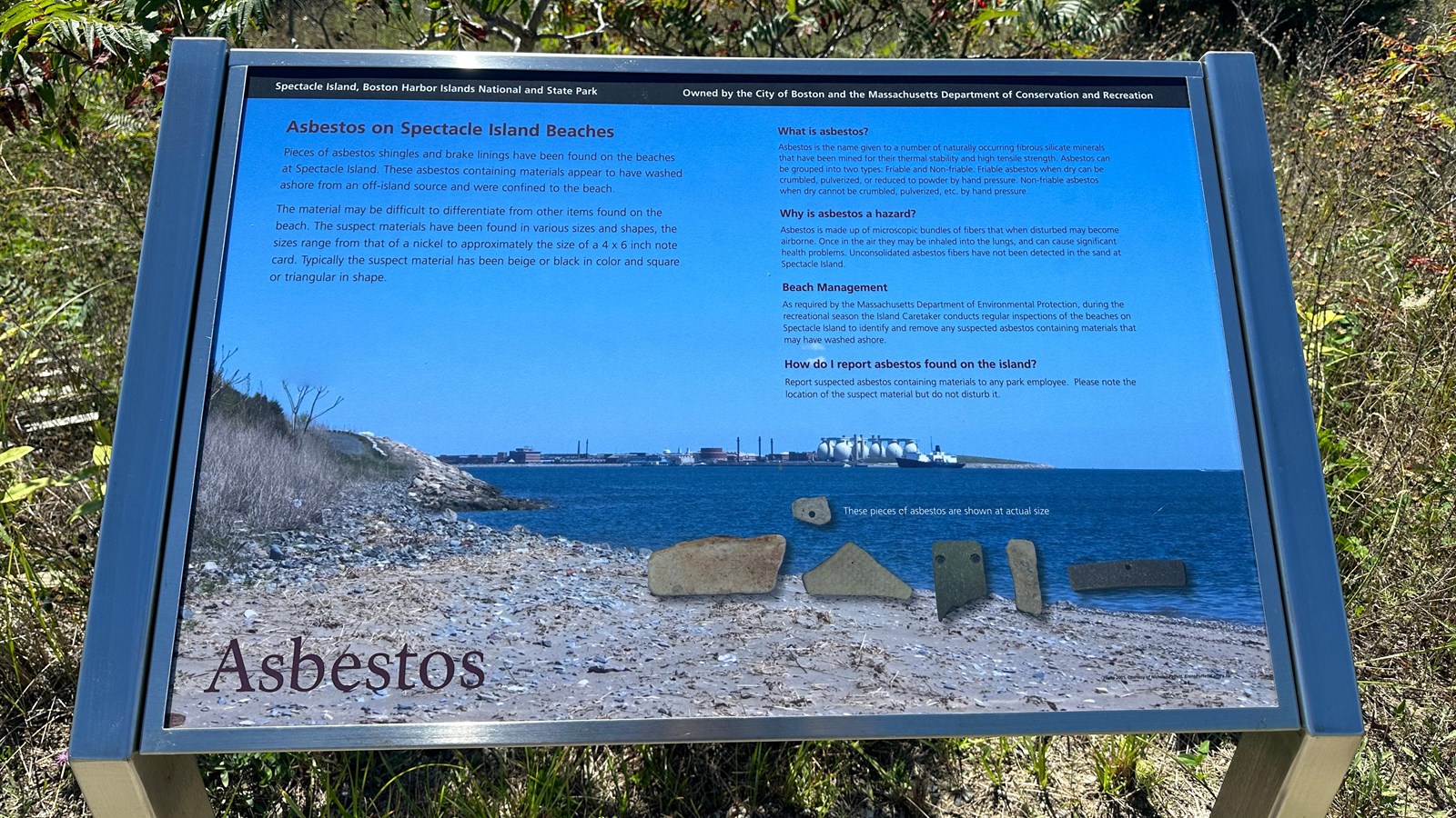 Photo of a metal wayside with a blue image on it