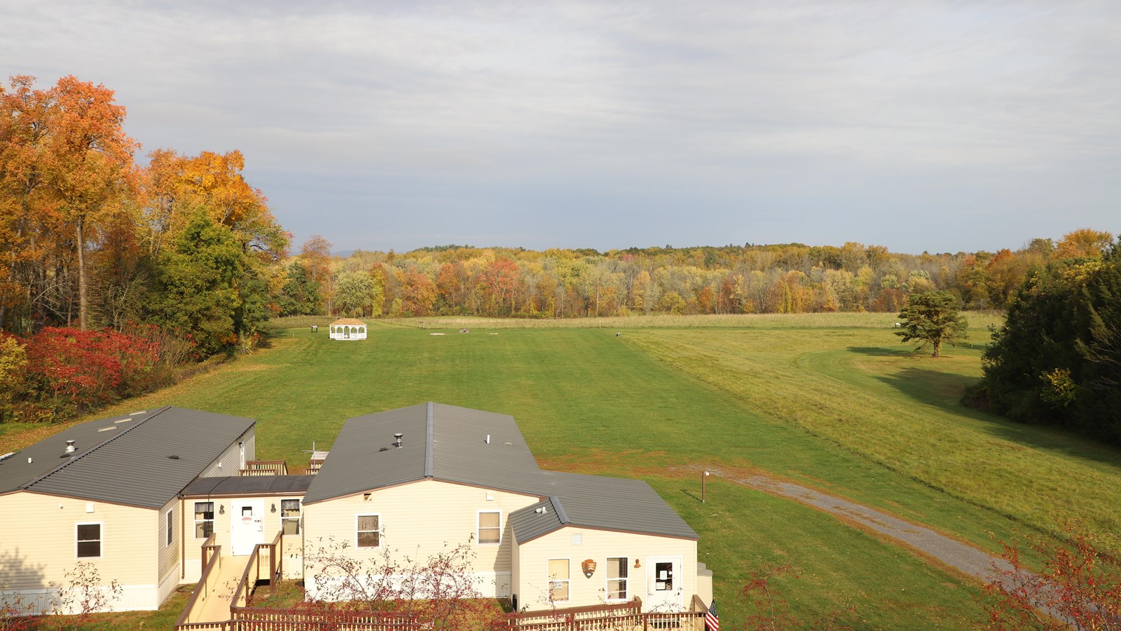 An aerial photo looking out towards the farm fields with visitor center in foreground