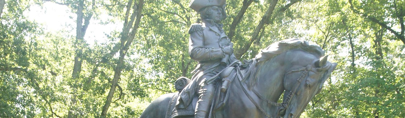 Equestrian monument of Major General Nathanael Greene, on a tall granite base.