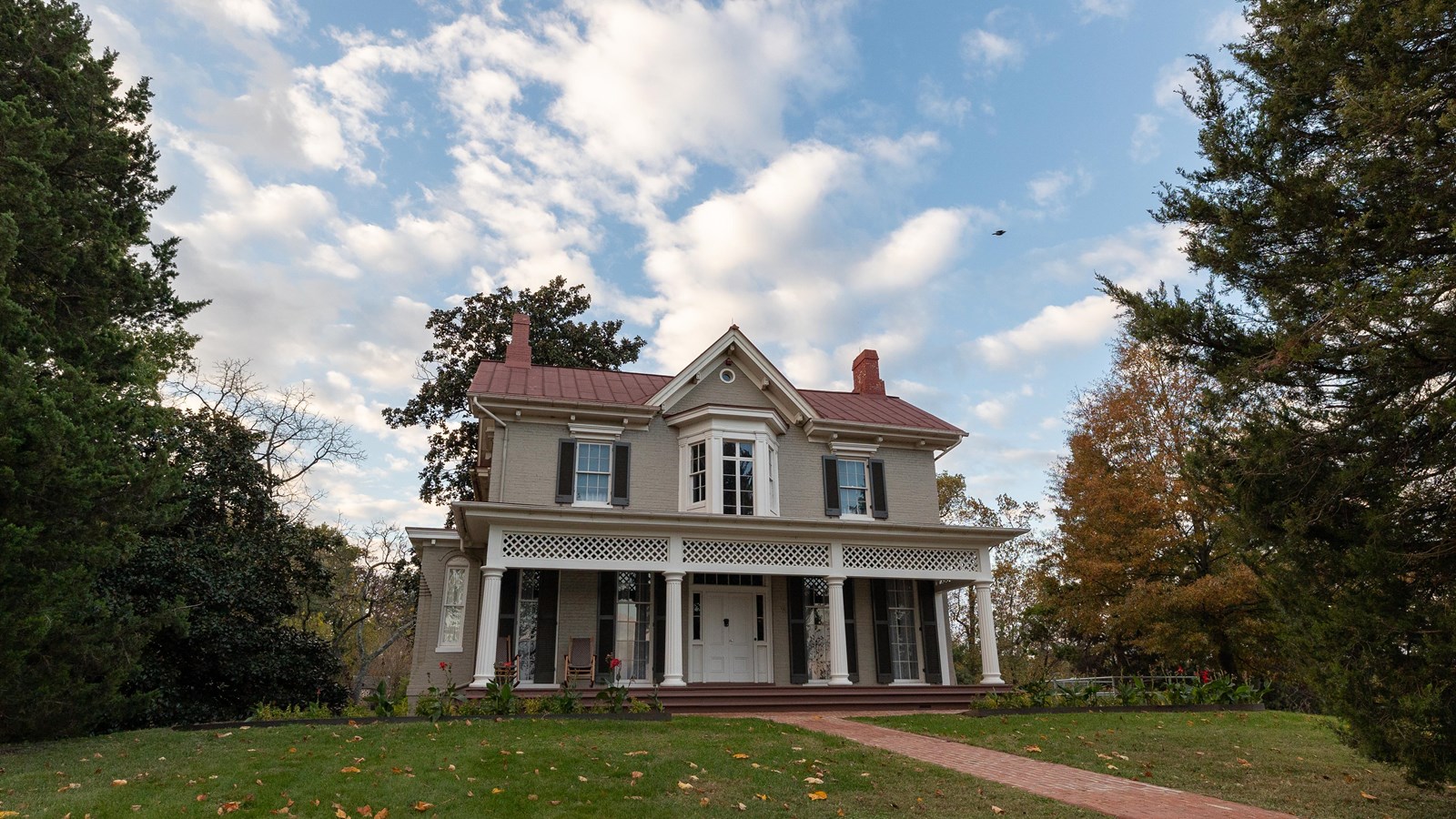 A large two story house on top of a hill overlooks Washington DC