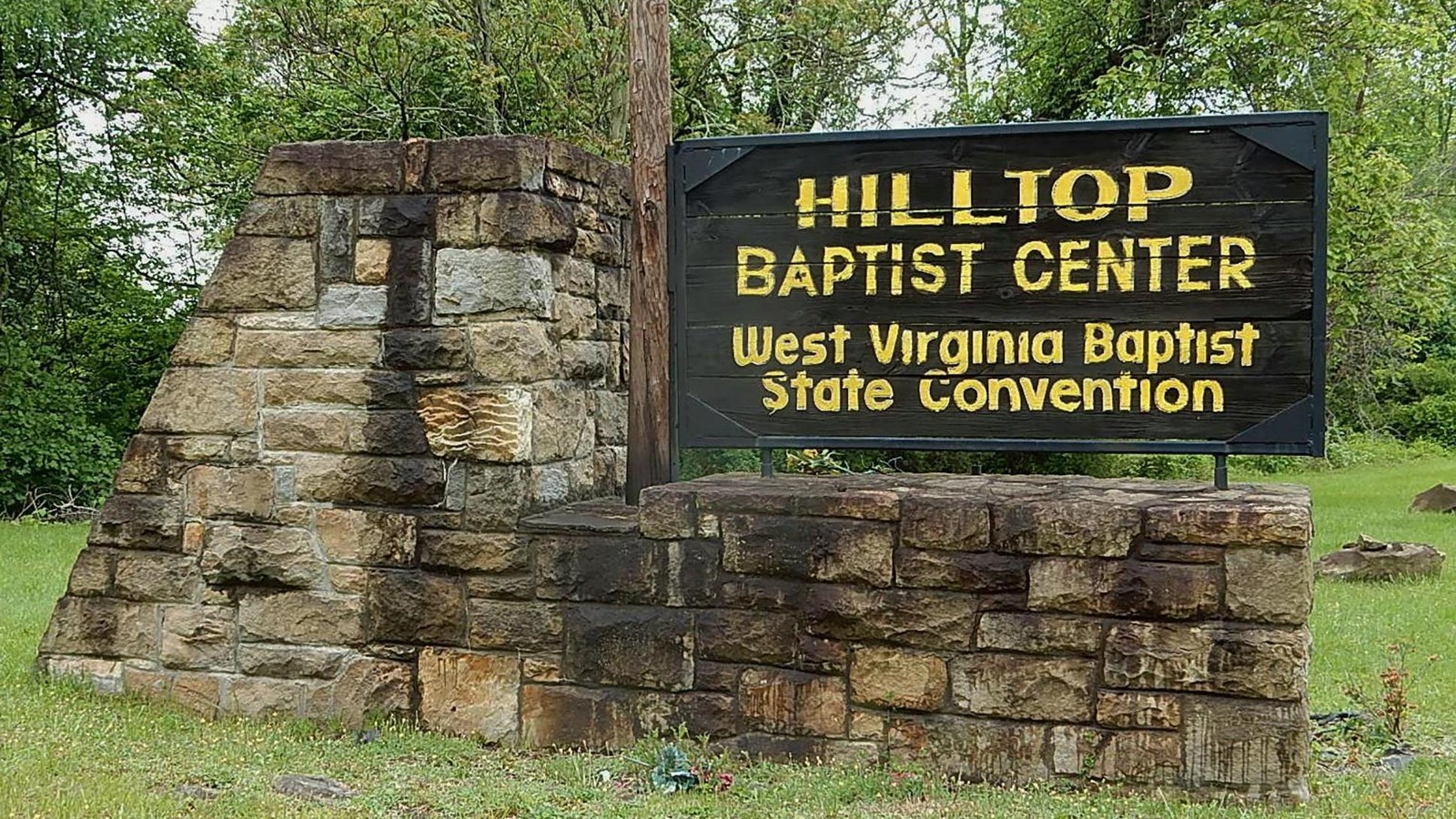 wood Baptist Center sign on stone base