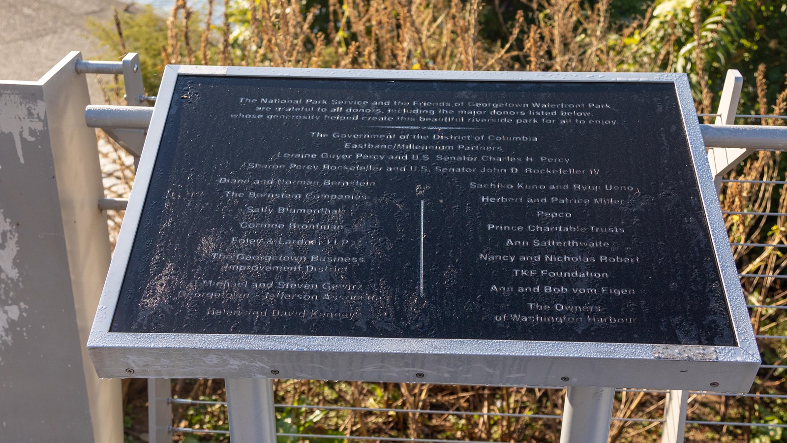 An angled plaque lists donors who helped develop the park.