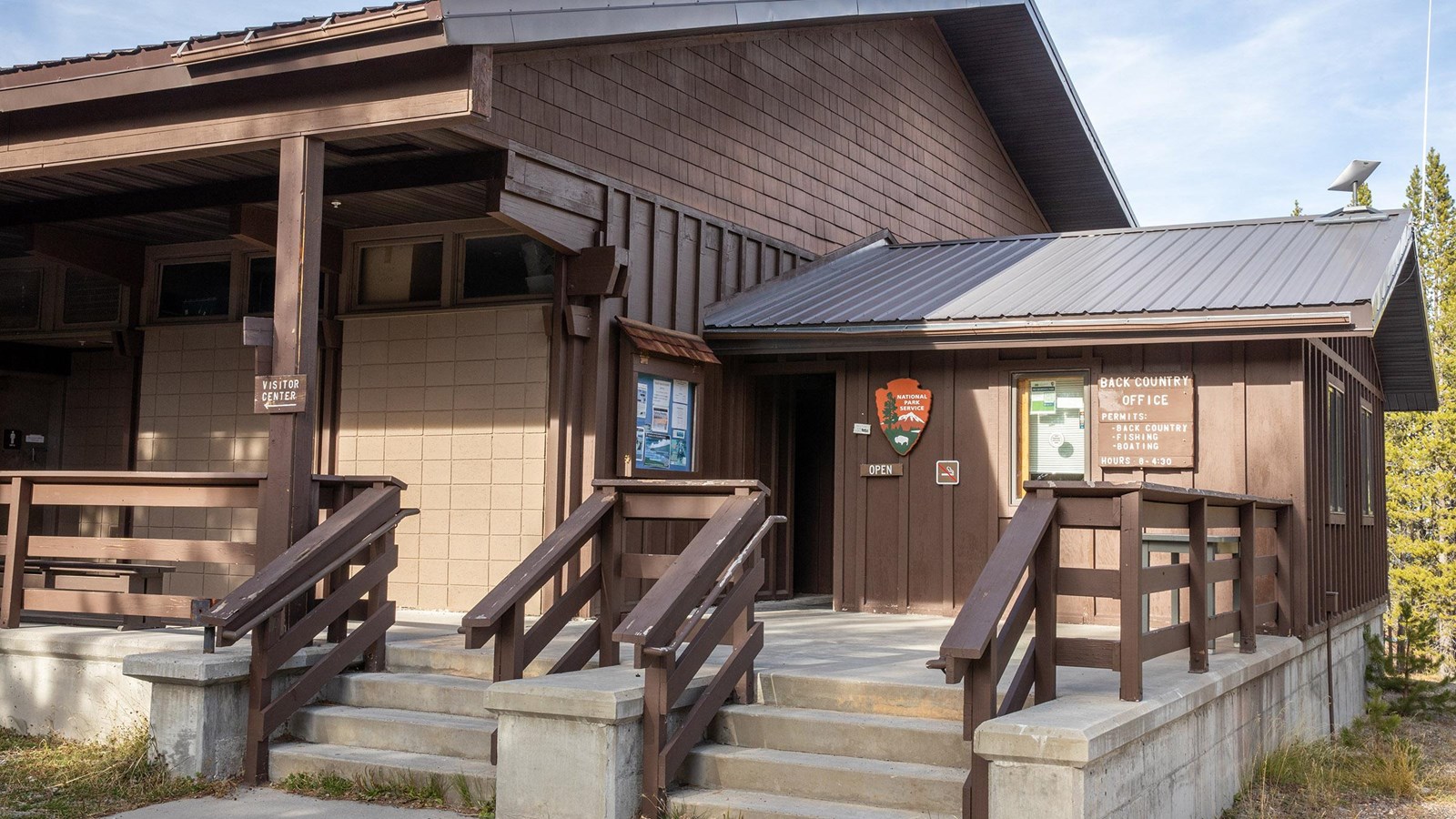 Exterior of stone and brown wood framed backcountry office