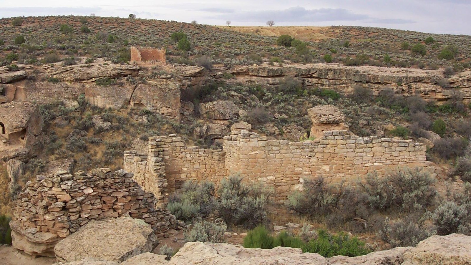 A standing wall of a structure overlooking the canyon.