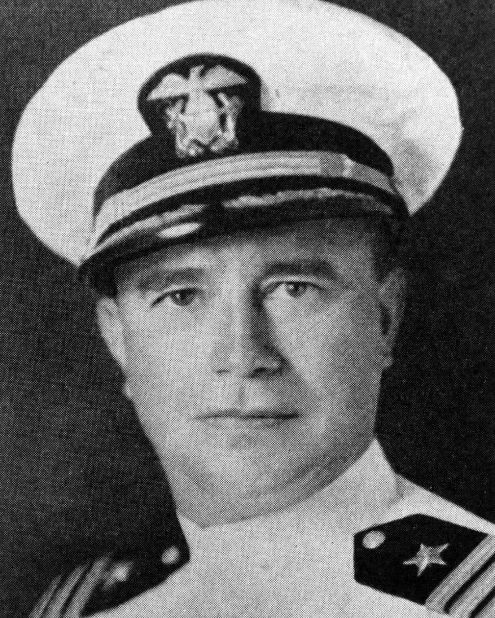 Portrait of a man in white naval uniform. 
