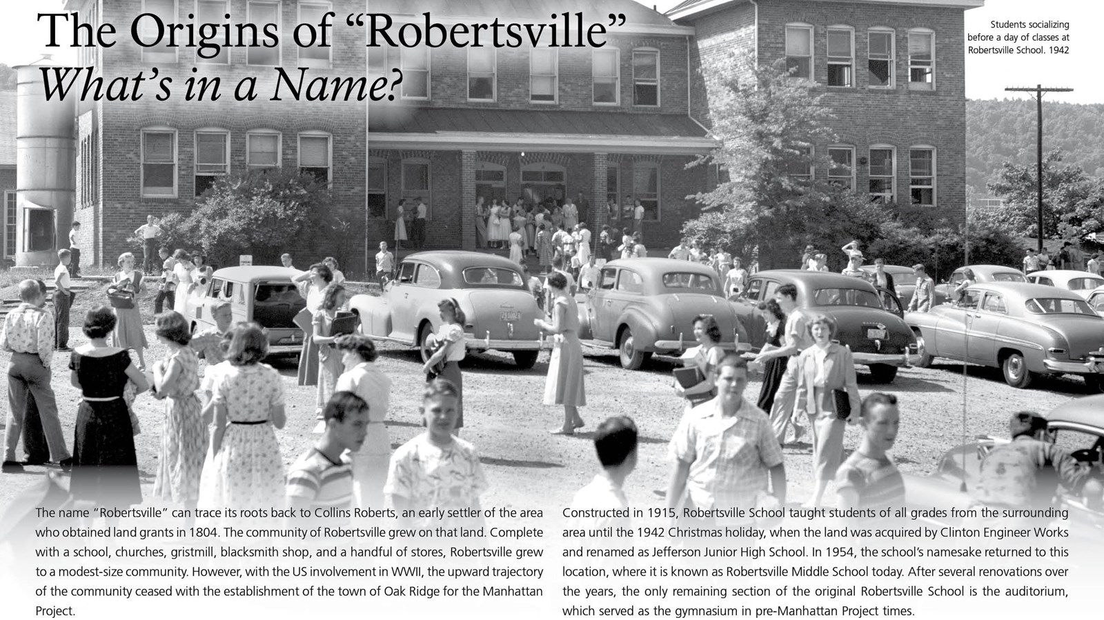 A wayside with text and an image of children in front of a school.