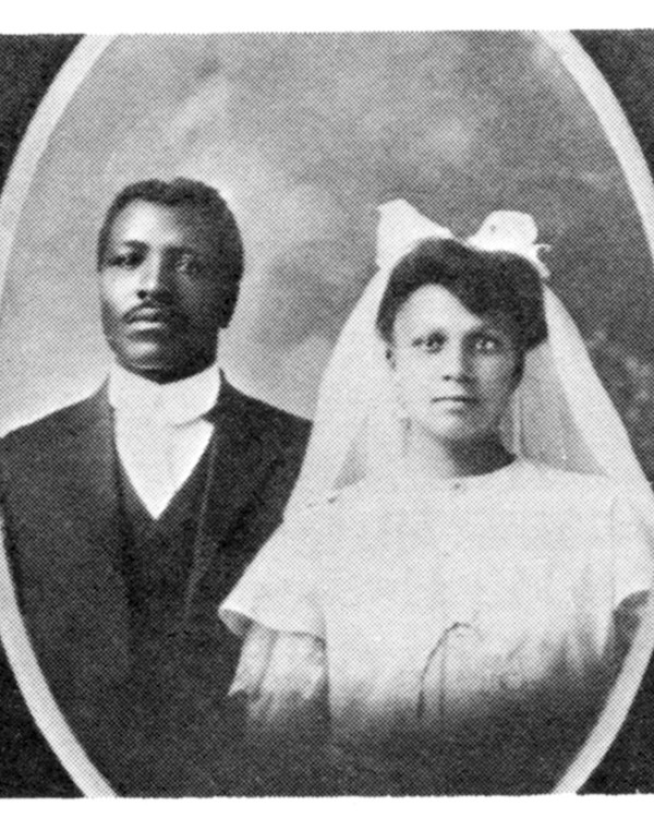A black and white portrait of Mr. and Mrs. Speese in their wedding attire.