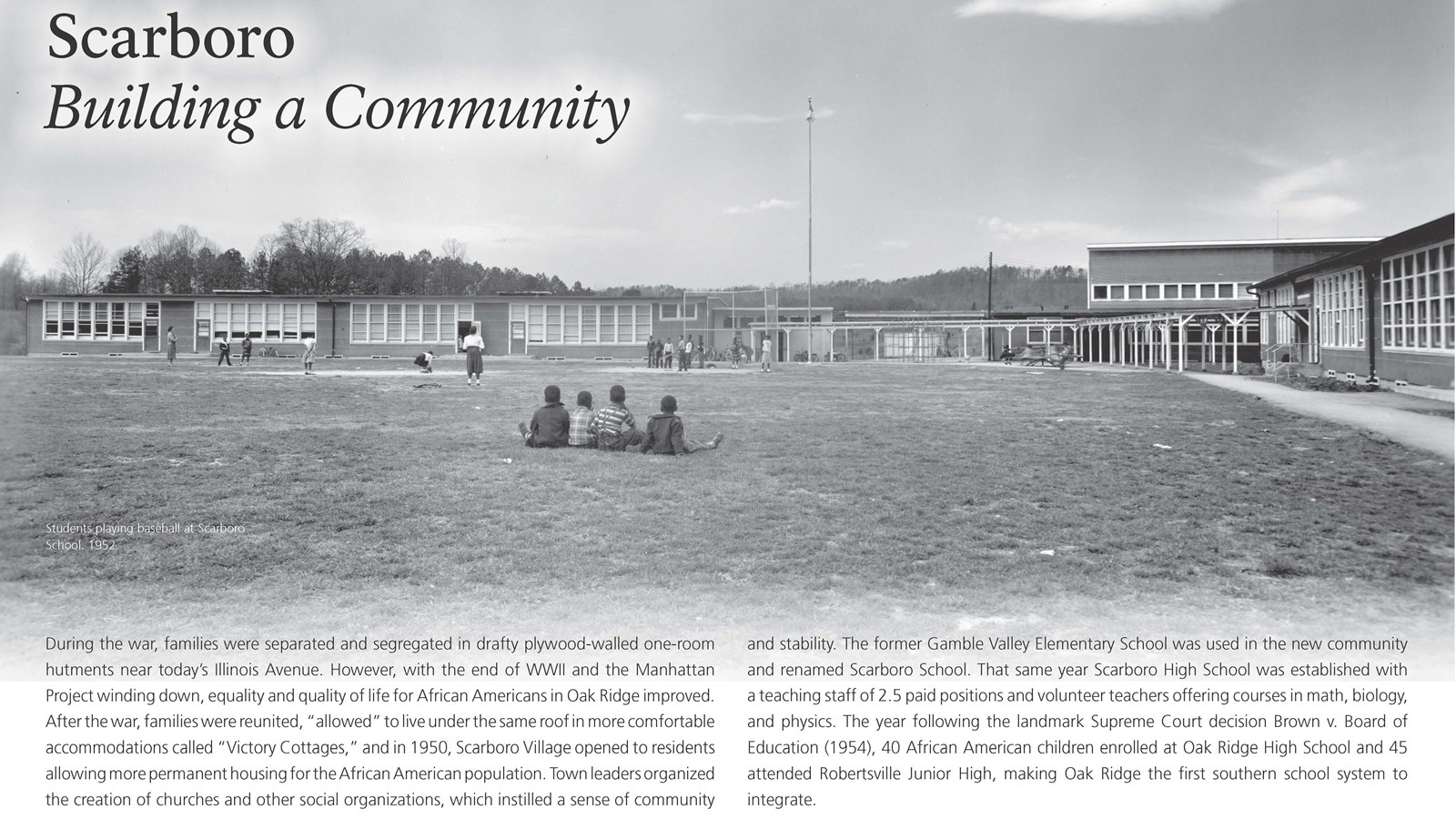 A wayside exhibit with text and an image of children in front of a school.